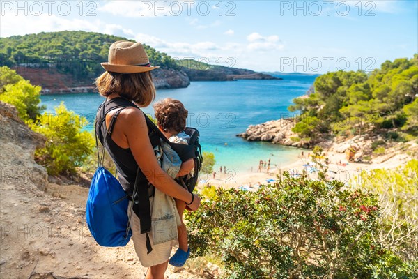 Mother with her son on the paradisiacal beaches on the coast of Ibiza