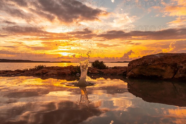 Drops of water after the throwing of a stone at sunset in San Antonio Abad