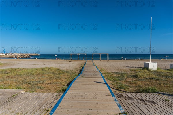 Wooden walkway to San Jose beach in the town of Nijar