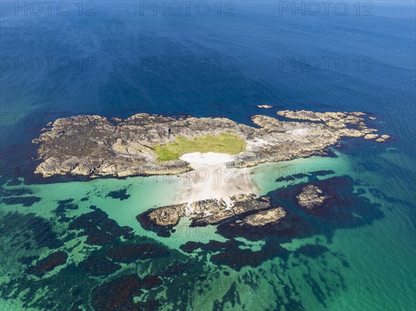 Aerial view of a deserted island with sandy beach