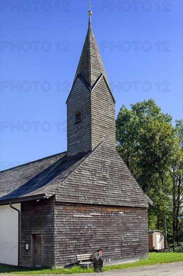 Chapel of St. Nicholas and St. Magdalena with many wooden shingles in Linsen near Niedersonthofen