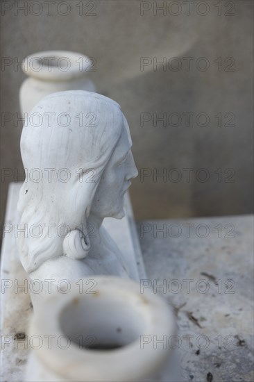 Simple grave with crumbling plaster