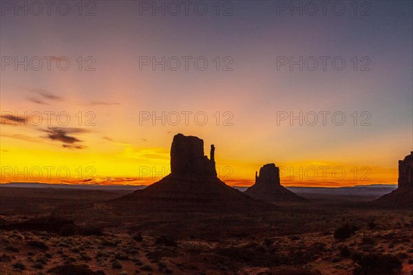 First pink sunrise lights at Monument Valley in the beautiful August sunrise