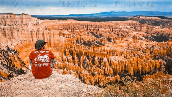 A young man watching the national park from Bryce Point