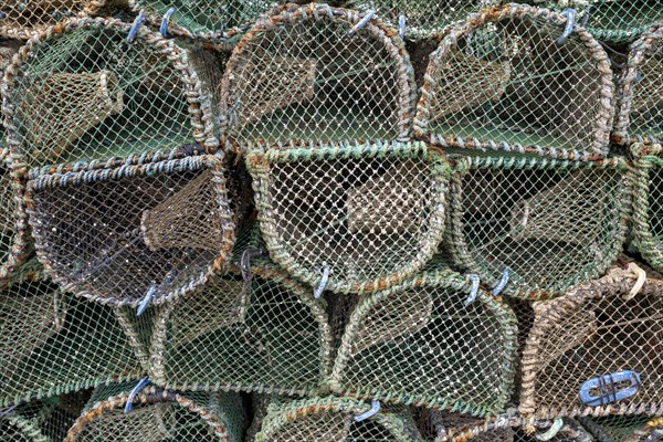 Lobster pots in the harbour of a coastal town