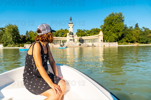 A tourist at the Estanque Grande de El Retiro in the city of Madrid. Spain