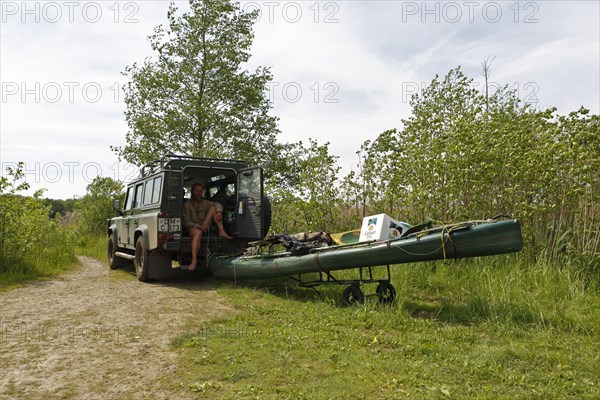 Transporting a boat with a car