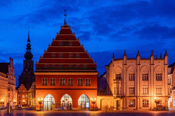 Architecture on the historic market square with town hall and Rats-Apotheke at the blue hour
