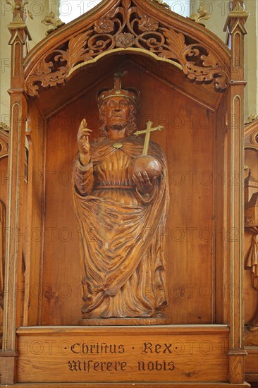 Sculpture of Jesus with orb on late Gothic altar with inscription