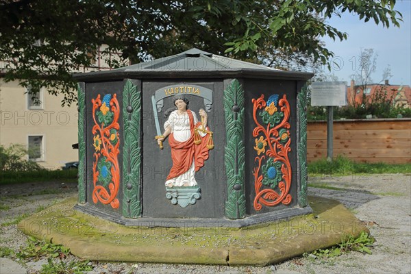 Abbey fountain built 1713 with relief and inscription