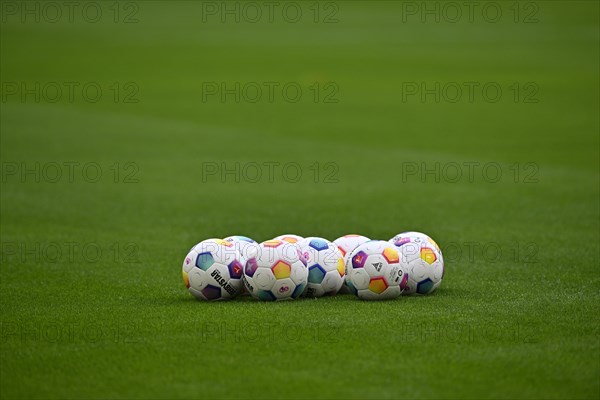 Adidas Derbystar match balls lie on grass