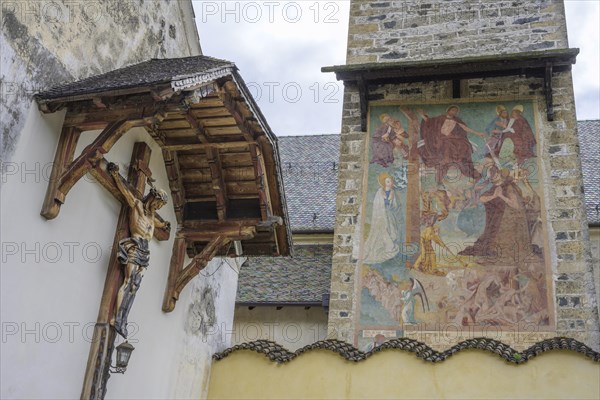 Cross and fresco at the parish church of St.Pankraz