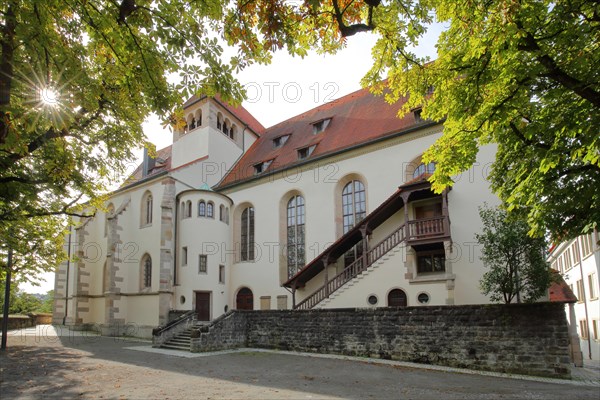 Late Gothic collegiate church of St. Pancratius with exterior staircase in backlight