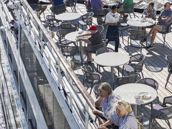 Passengers looking over the railing