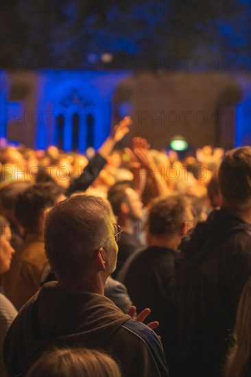 Cheering crowd at Live Klostersommer Festival in Historic Monastery