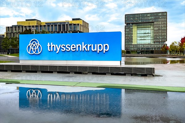 View of headquarters in the background in the form of cube of steel giant company of steel production manufacturer of steel thyssenkrupp Thyssen Krupp in the foreground logo and lettering