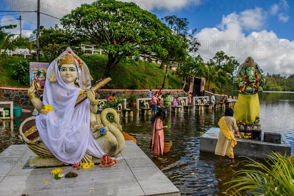 Left Goddess of Wisdom Sarasvati Saraswati Maa Wife Consort of Lord Brahma Right God Deity Statue in Elephant Shape Shape of Elephant Elephant God Ganesha at Religious Site Largest Hindu Sanctuary Sanctuary for Religion Hinduism outside India for devout Hindu Hindus