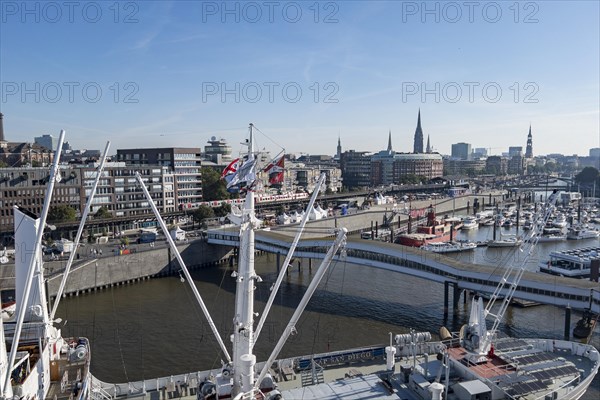 View of Niederhafen harbour and the museum ship Cap San Diego at the Ueberseebruecke bridge in the Port of Hamburg from a cruise ship