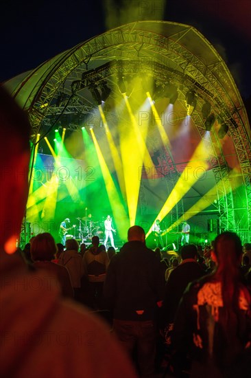 Cheering crowd at Live Klostersommer Festival in Historic Monastery