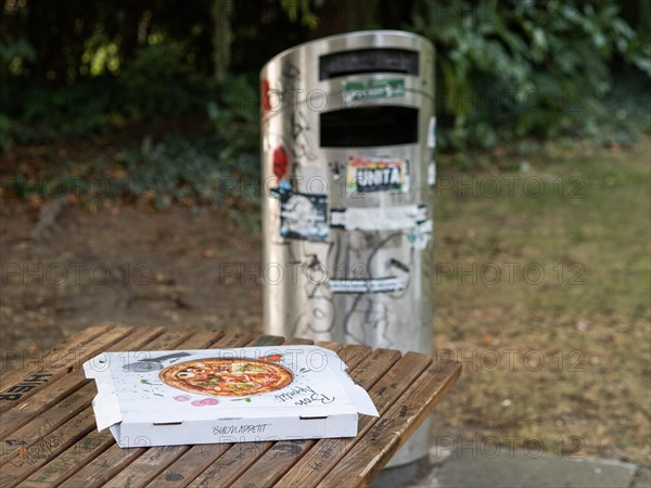 Pizza box on a parking table