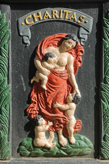 Relief with figure and inscription Charitas at the Abbey Fountain built 1713