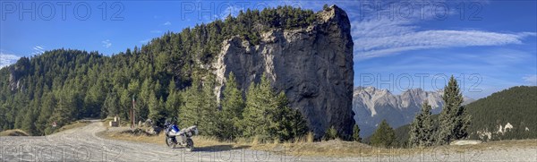 Motorbike BMW R1200 GS Adventure on a steep rock near Forte Pramand