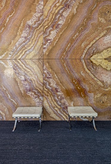 Barcelona chair and onyx wall