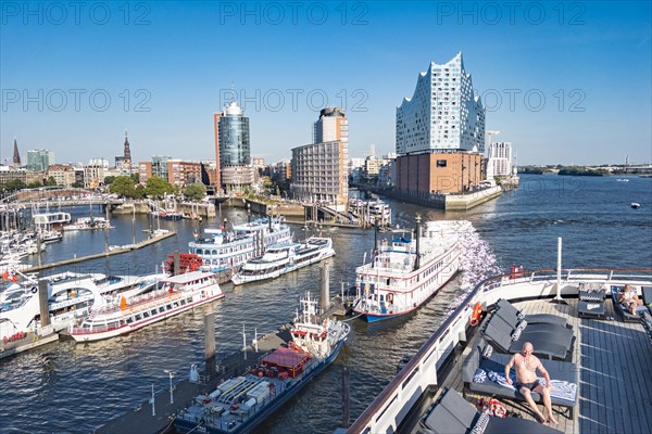 Passengers on the pool deck of the cruise ship Vasco da Gama moored at the Ueberseebruecke in the port of Hamburg