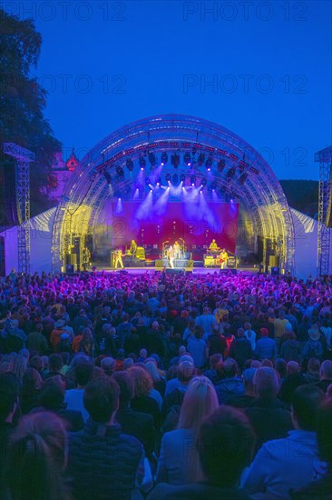 Cheering crowd at Live Klostersommer Festival in Historic Monastery