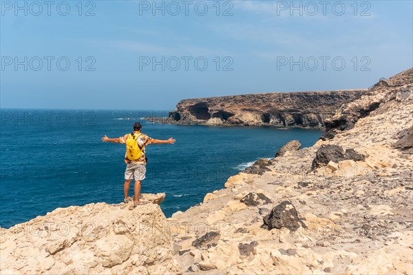 A young tourist on the trail heading to the caves of Ajuy