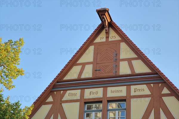 Gable of half-timbered house with inscription
