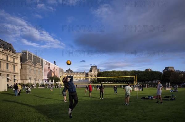 Young people playing volleyball