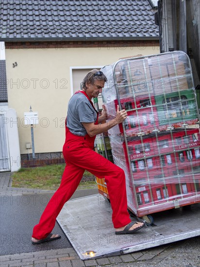 Man at loading ramp truck