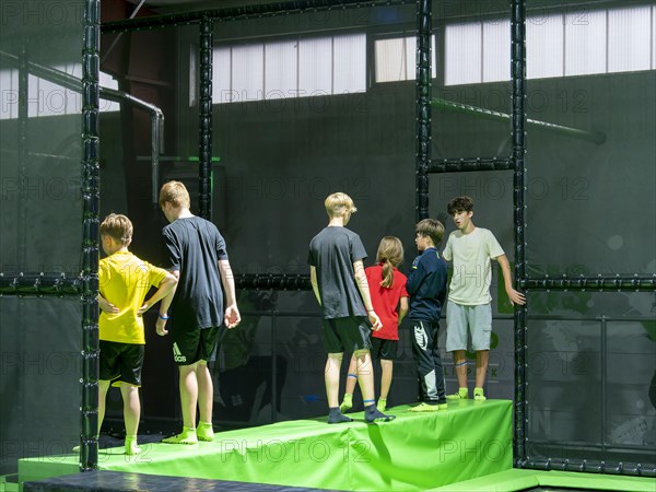 Children in trampoline arena