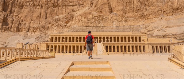 A young woman visiting the Mortuary Temple of Hatshepsut without people on her return from tourism in Luxor after the coronavirua pandemic