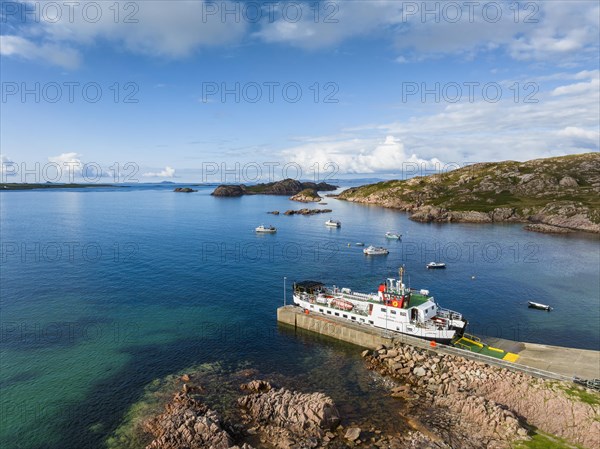 Aerial view of the Fionnphort ferry terminal with the ferry MV Loch Buie of the shipping company Caledonian MacBrayne operating a scheduled service between Fionnphort and the Isle of Iona