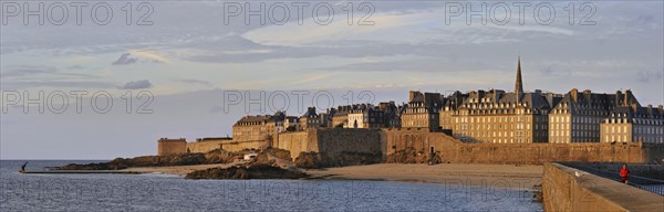 View over the walled city Saint-Malo from mole at sunset