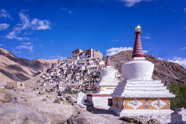 Stupas in front of Chemrey Gompa