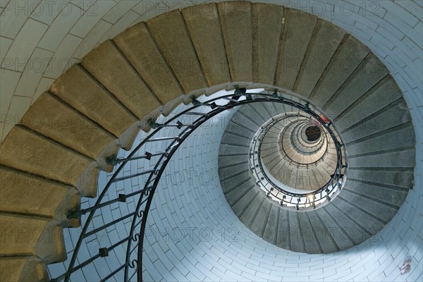 Spiral staircase inside the Phare d'Eckmuehl lighthouse in Penmarch. Brittany