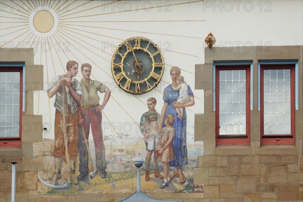 Sundial and mural at the town hall