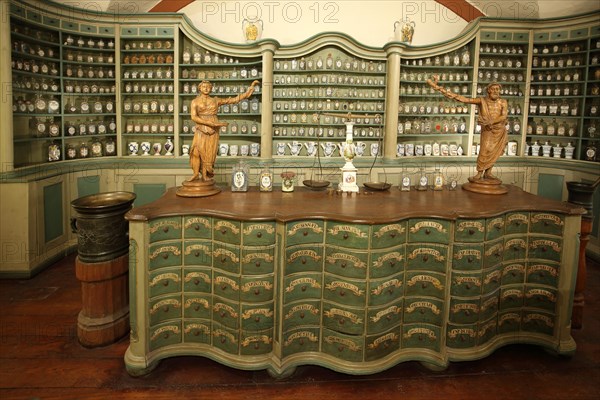 Interior view with chest of drawers and historical accessories