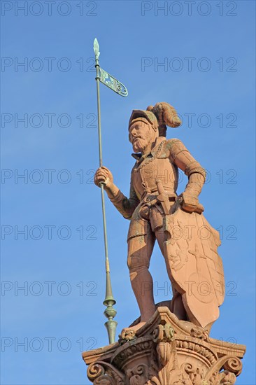 Market fountain with medieval sculpture Landsknecht