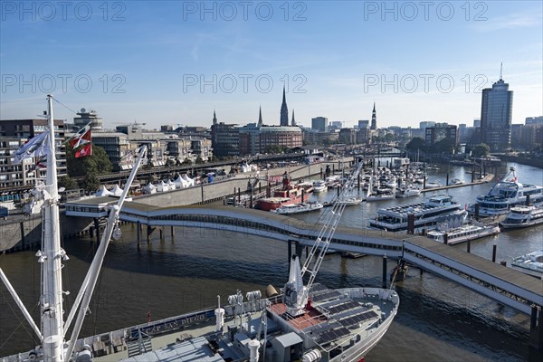 View of Niederhafen harbour and the museum ship Cap San Diego at the Ueberseebruecke bridge in the Port of Hamburg from a cruise ship