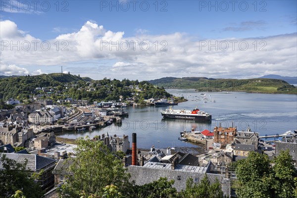 View over the harbour town of Oban to the ferry harbour with the ferry Isle of Lewis operating between Oban and Isle of Barra