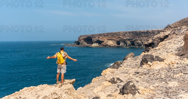 A young tourist on the trail heading to the caves of Ajuy