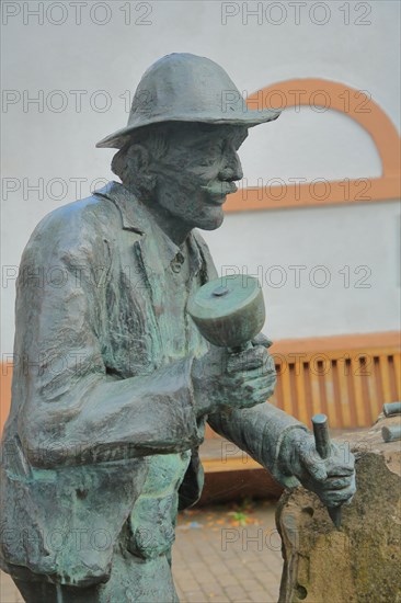 Stone mason fountain with sculpture