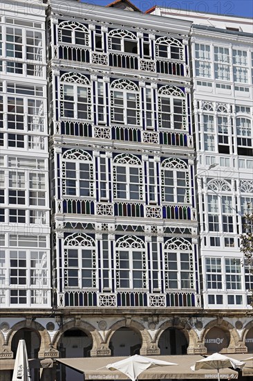 Decorative house facades on the harbour promenade in the historic city centre of La Coruna