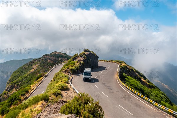 A van cornering at the Miradouro Lombo do Mouro