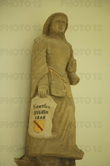 Saint Ottilia with coat of arms and shield Sculpture in Ottilien Chapel built 1473