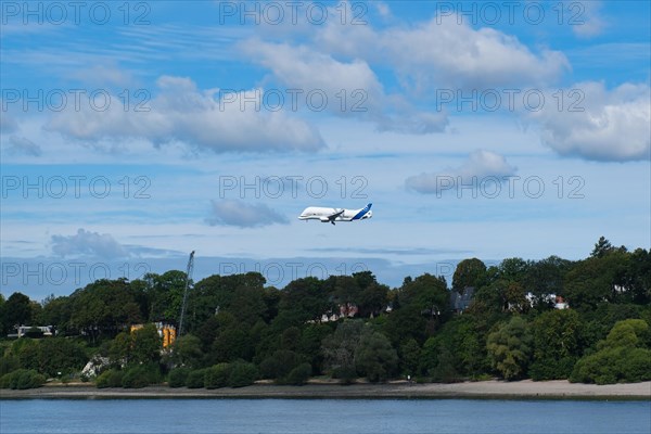 Plane over the Elbe beach in Hamburg harbour